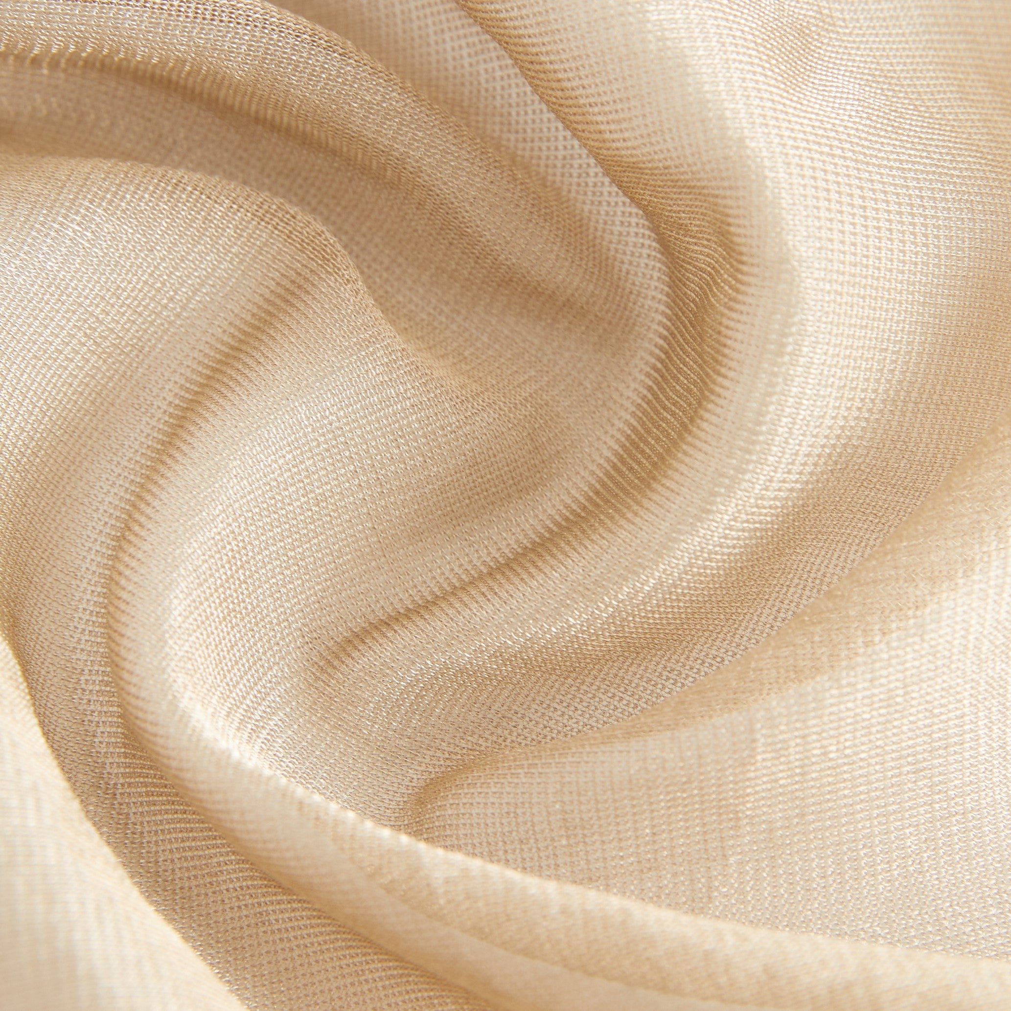 Close-up of cream-colored open mesh fabric