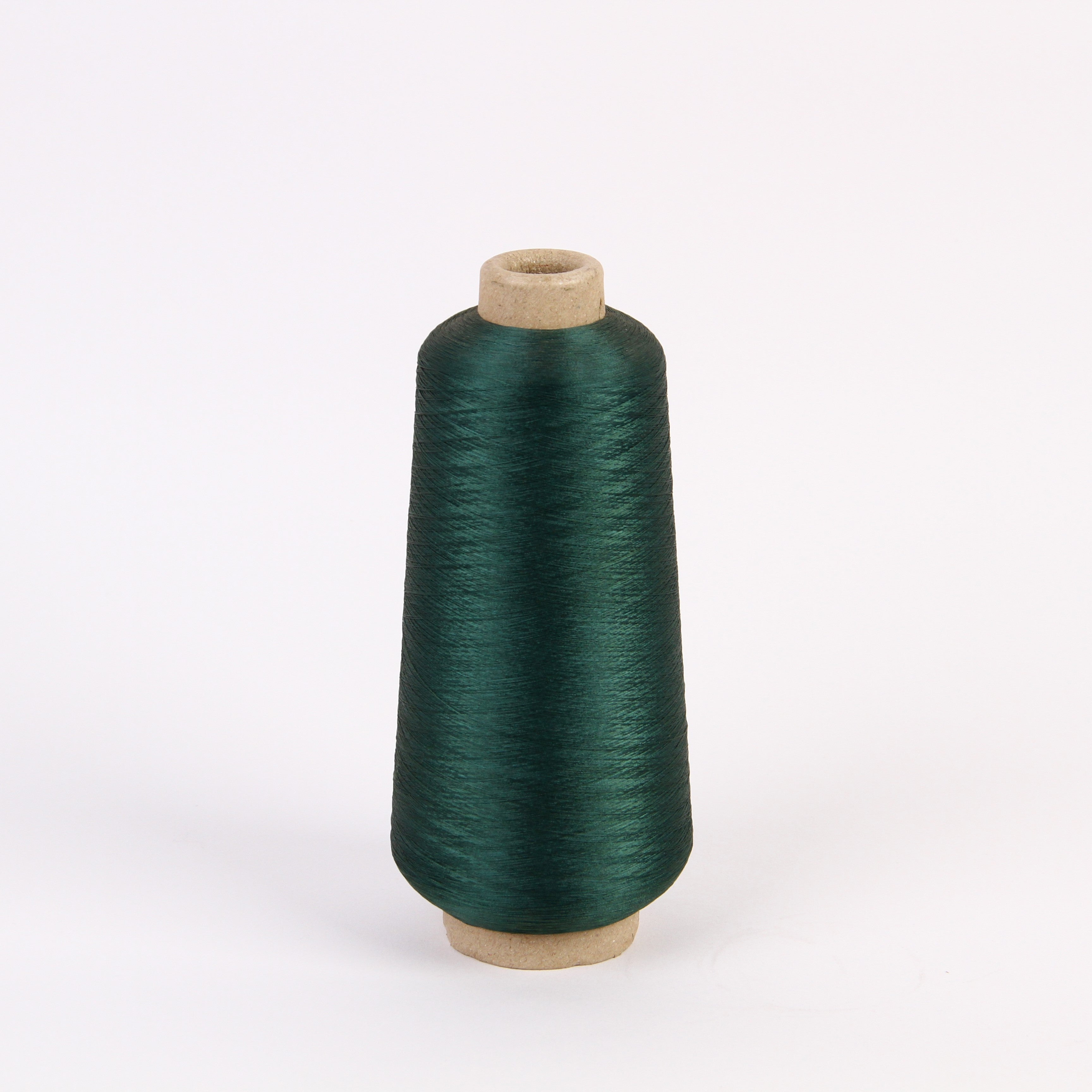 Spools of dark copper-nylon conductive yarn