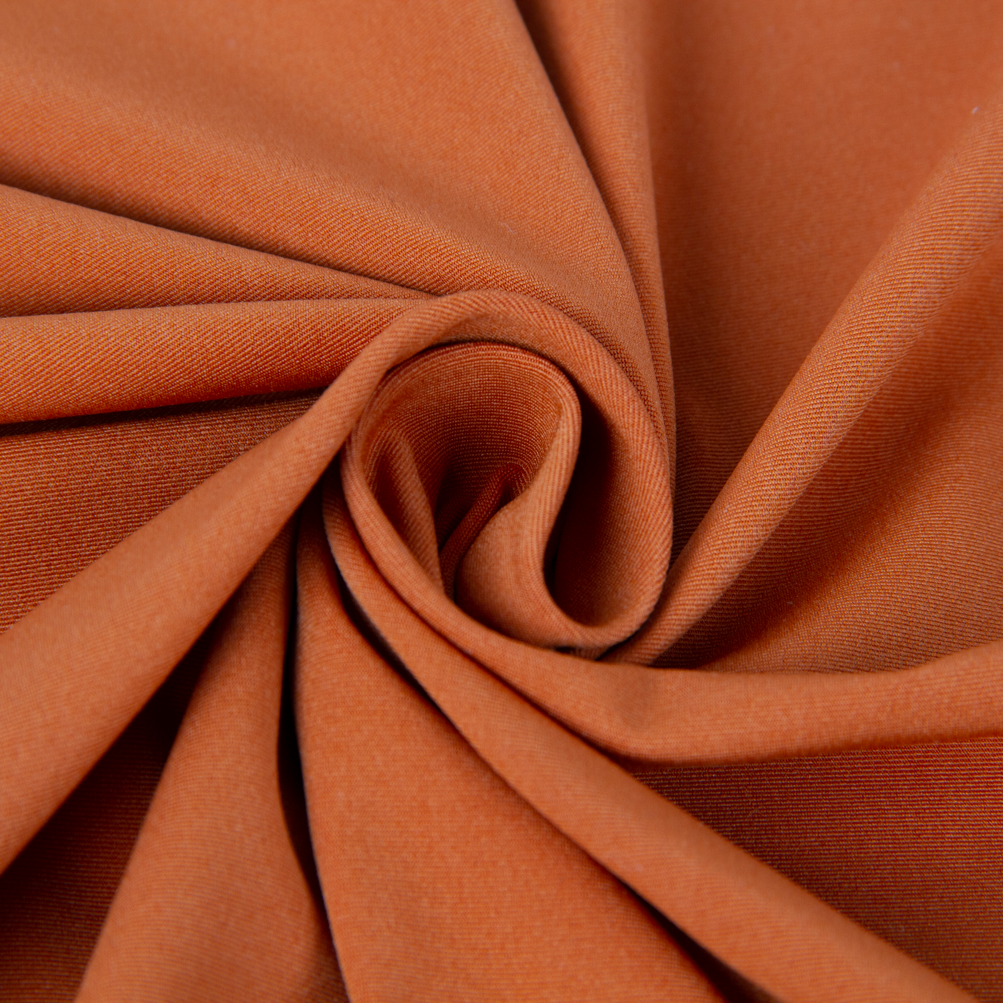 Copper-infused nylon fabric in a rust-orange color