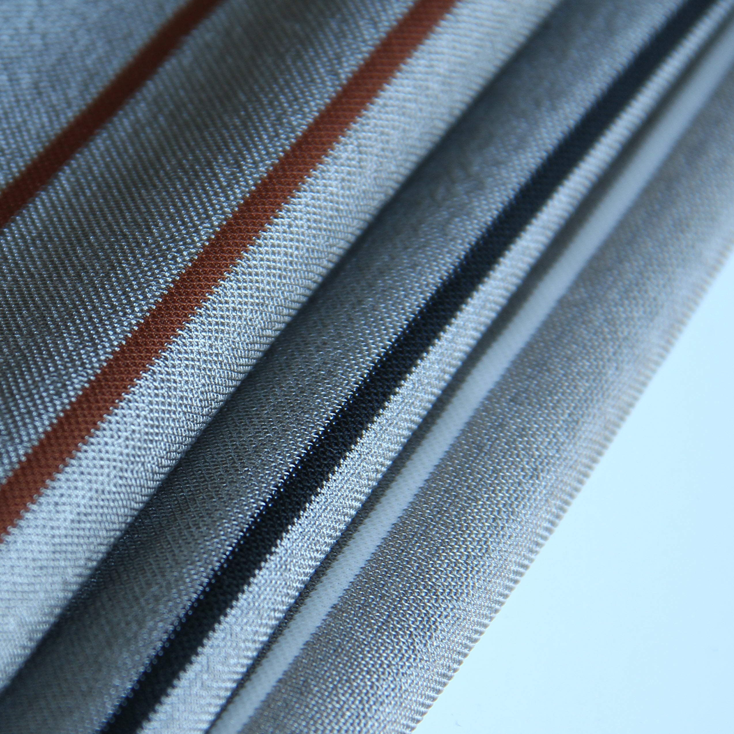 Silver Conductive Textile can be customized in any spacing. Picture showed is a 1mm conductive strip and 42 mm insulated strip