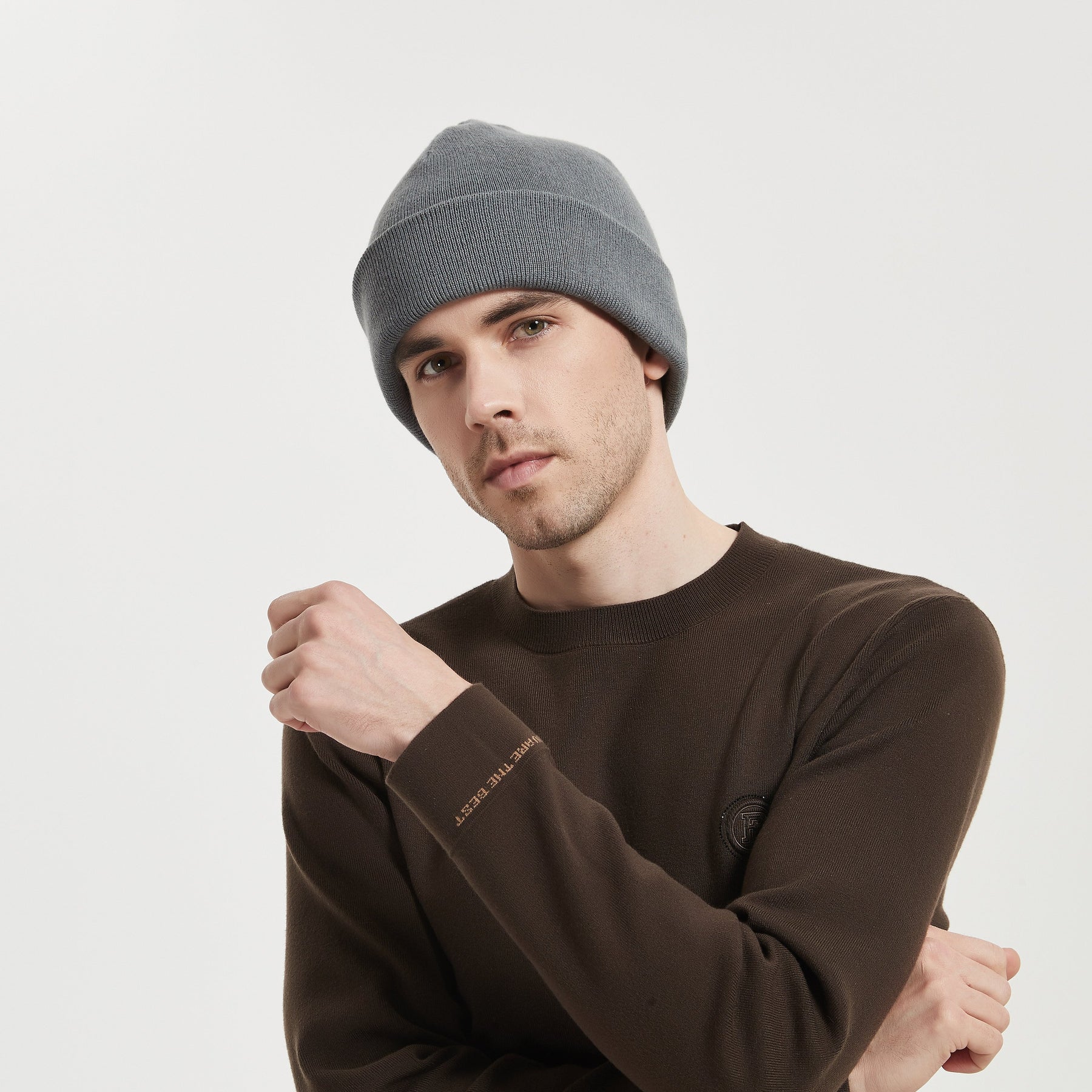 A male model wears a grey color radiatio proof beanie, front view