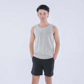 Male model wearing a EMF tank top in heather grey color