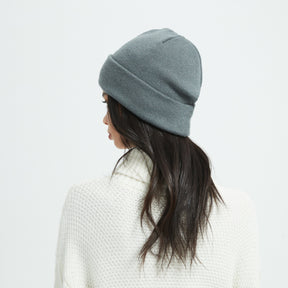 Girl with a grey clor radiation proof winter beanie, back view