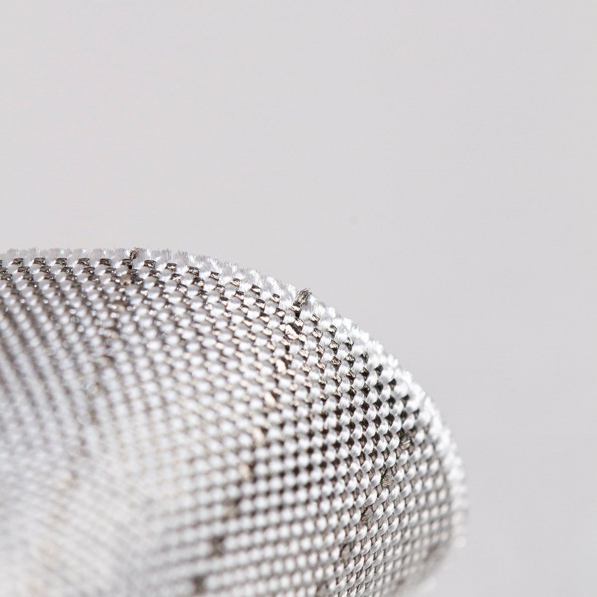 Close view of silver conductive fencing fabric that designed for fencing lamé jacket like foil and sabre