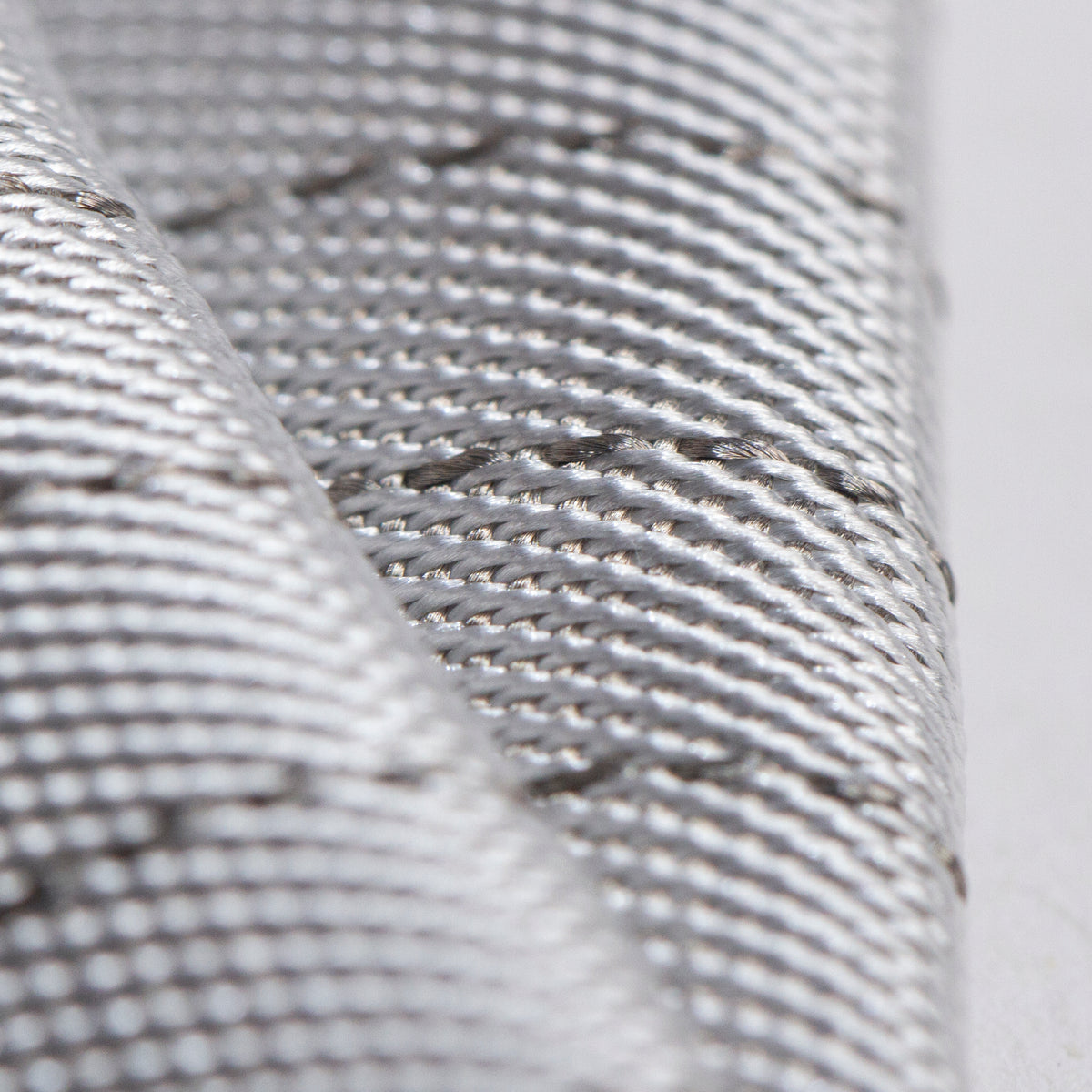 Close view of siver fabric grey color that designed for fencing lamé jacket