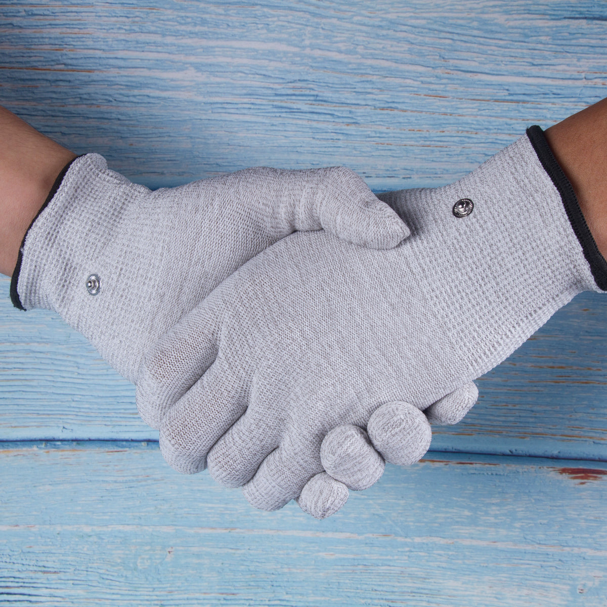 TENS Therapy gloves with conductive material to help Arithritis Patient