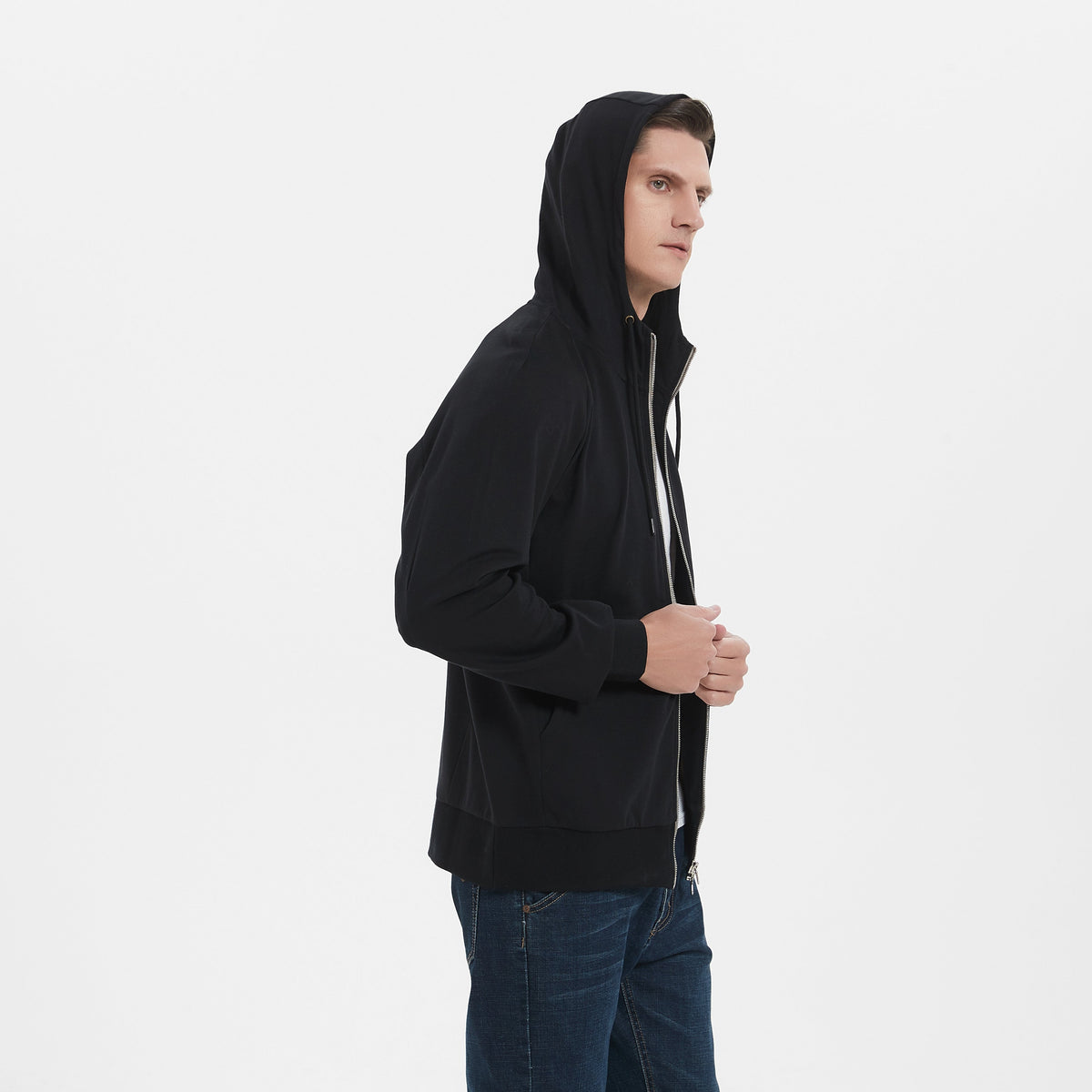 Sideview of EMF Shielidng Zip-up hoodie. A Male strong and tall model is wearing it.