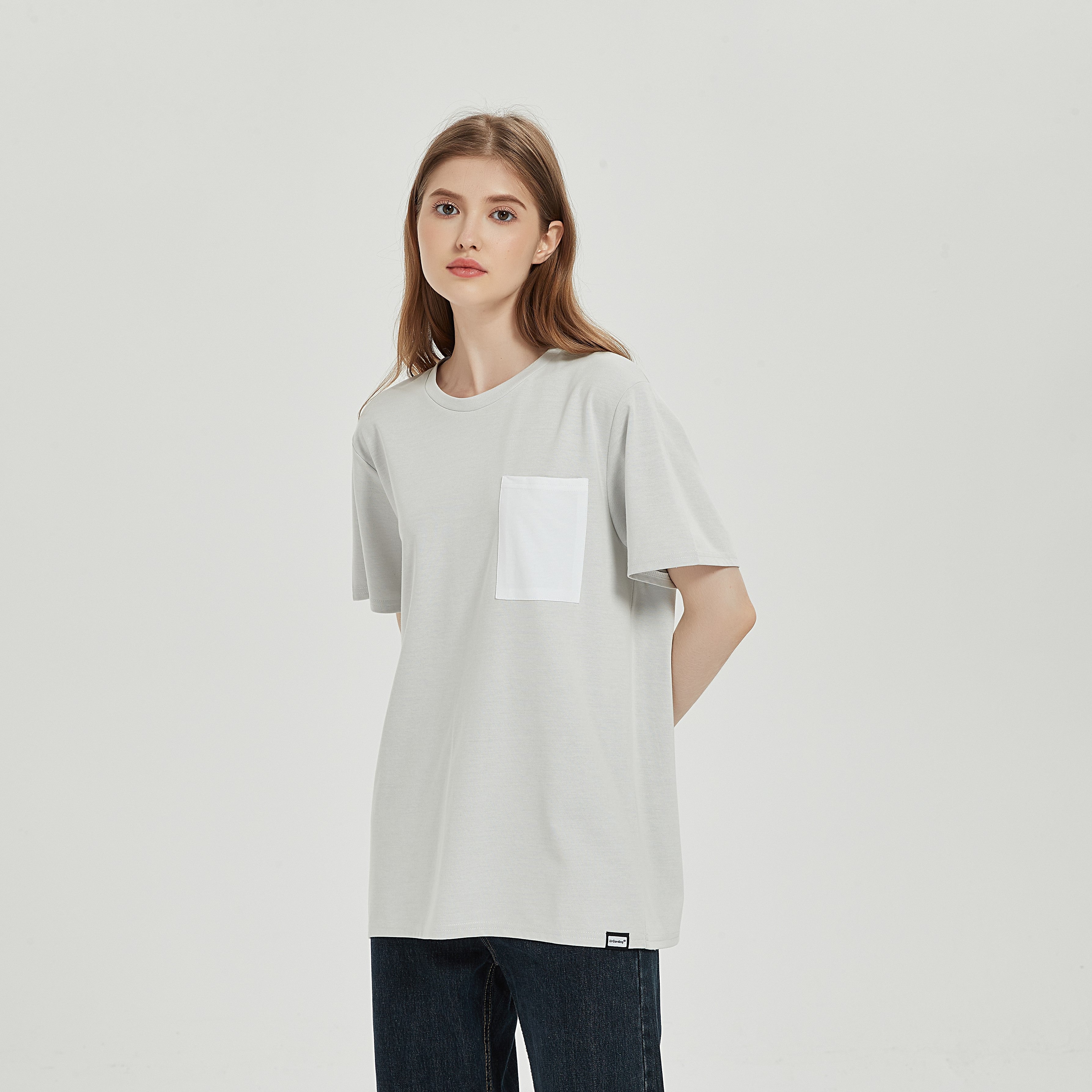 A female model is wearing EMF shielding Pocket T-shirt made from silver fiber fabric