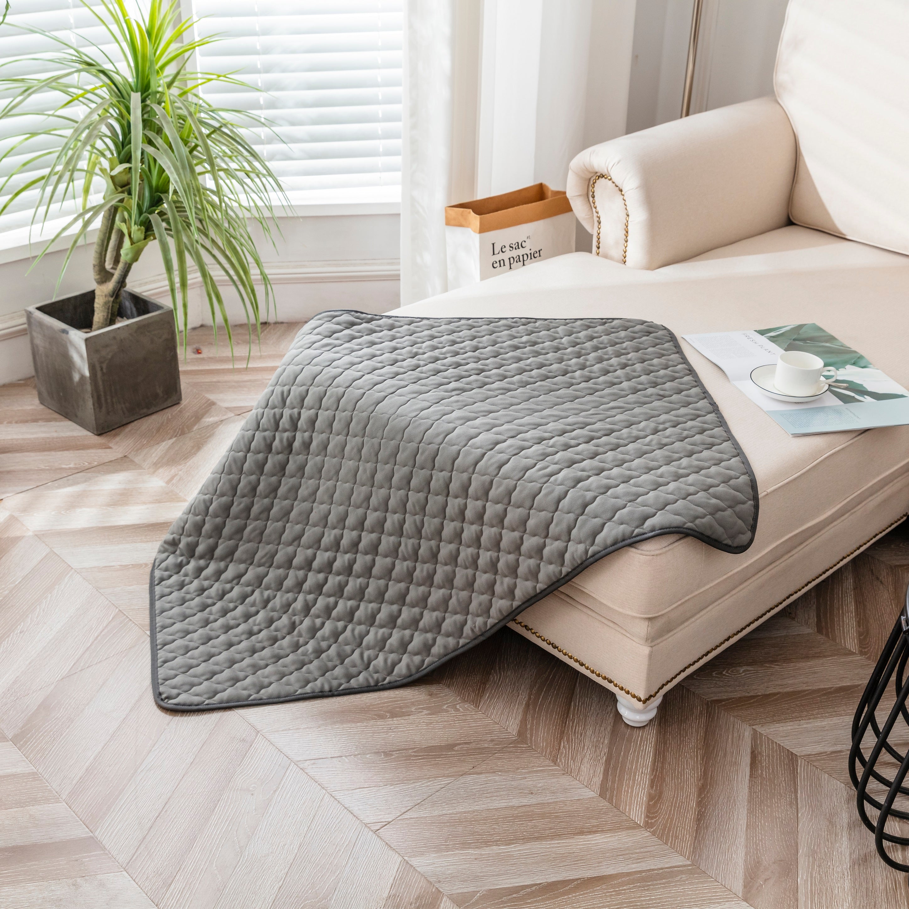 Ground Earthing Mat made from silver Bamboo, on top of sofa