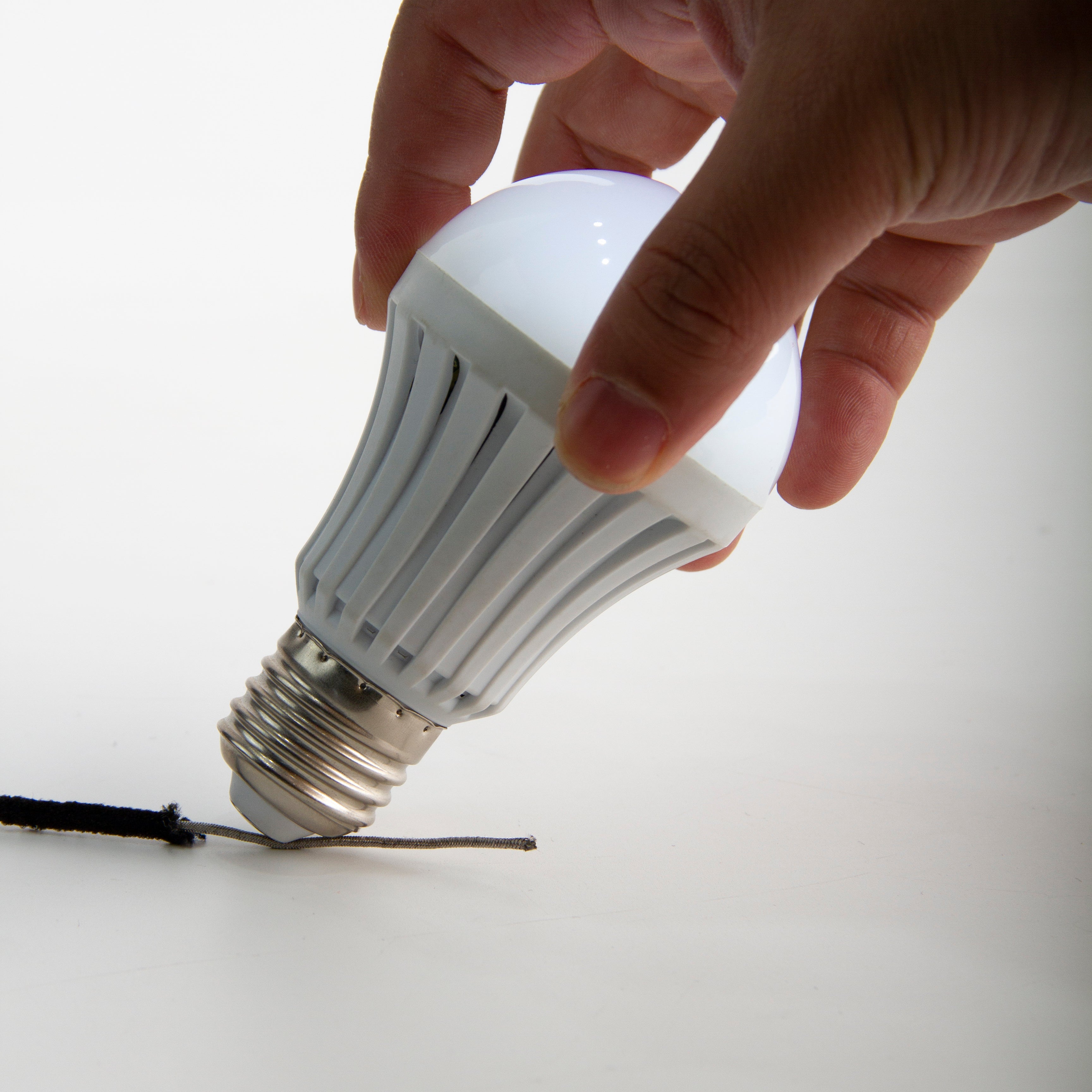 Light bulb is able to shine once connected to silver conductive elastic cable