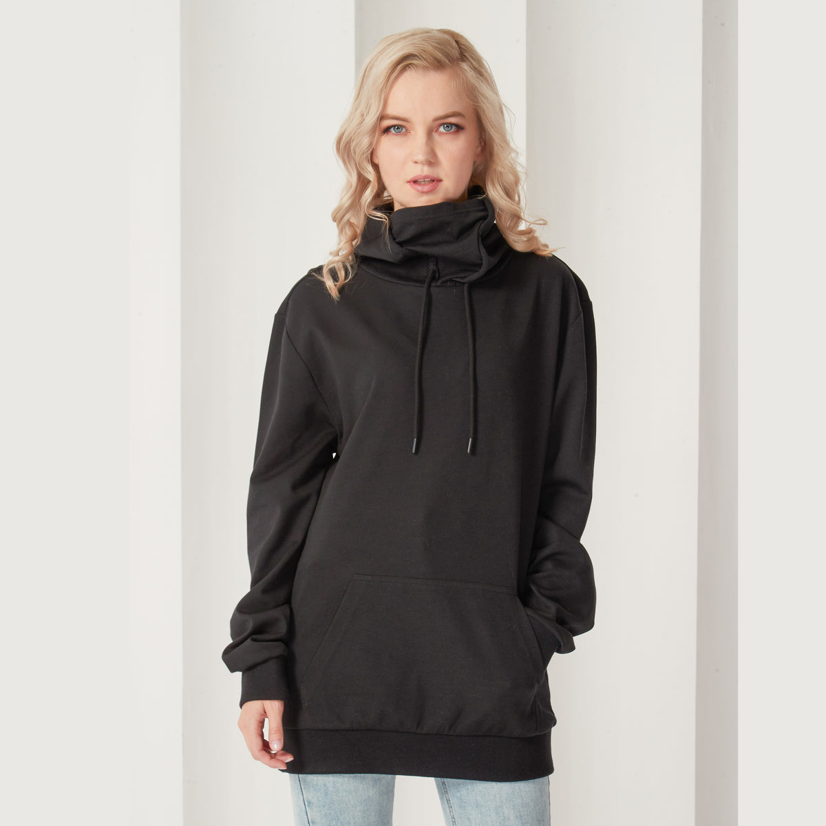Black pullover hoodie with attached face mask lowered, front view